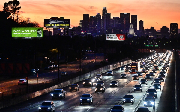 Cars head east out of Los Angeles during evening rush hour on January 25, 2024. They may have to drive slower if Calif. Gov. Gavin Newsom signs a bill requiring new passenger vehicles and large trucks sold in California to have technology to prevent drivers from going more than 10 miles an hour above the speed limit.