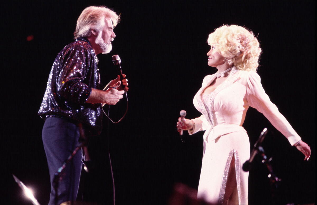 Dolly Parton didn't just write hits — she created an American songbook 4 American Country musicians Kenny Rogers (1938 - 2020) and Dolly Parton perform together onstage at Nassau Coliseum, Uniondale, New York, August 29, 1985.