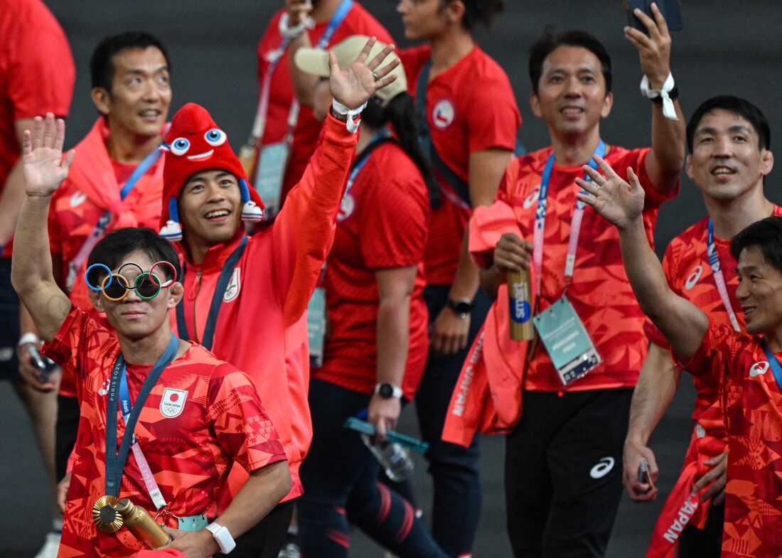 Japan's athletes take part in the athletes parade during the closing ceremony on Sunday.