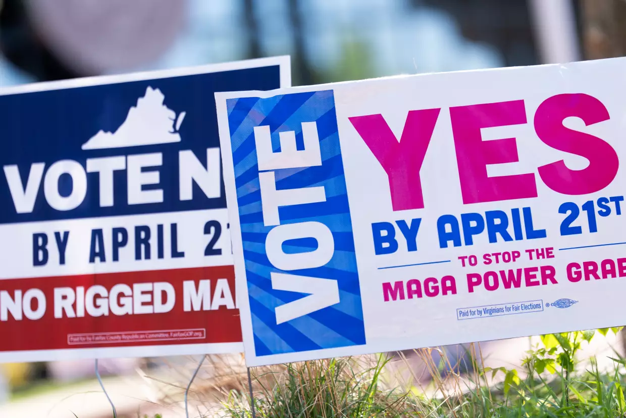 Signs are seen during the Virginia redistricting referendum on April 21 in Fairfax, Va.