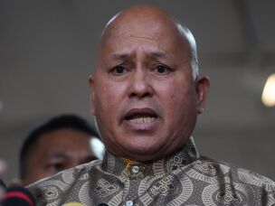Philippine Sen. Ronald dela Rosa speaks to reporters at the Philippine Senate in Pasay, Philippines on Wednesday.