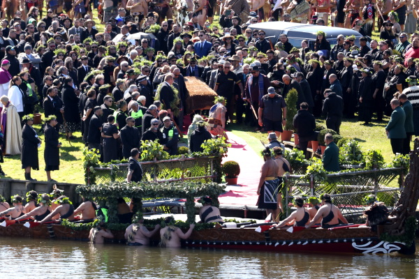 Mourners pay their respects to the late Māori King Tuheitia Pootatau Te Wherowhero VII as his coffin is carried toward the Waikato River en route to his final resting place in Hamilton, New Zealand, on Thursday.