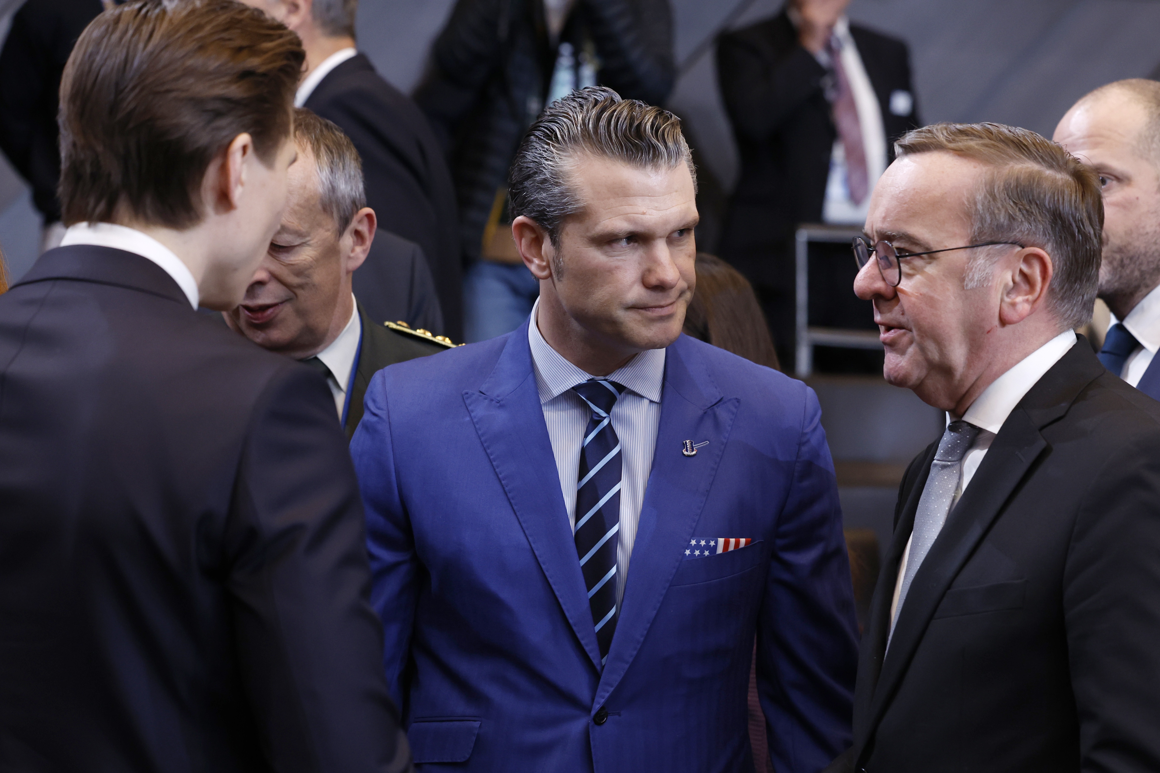 U.S. Defense Secretary Pete Hegseth (center) speaks with German Defense Minister Boris Pistorius (right) and Finland's defense minister, Antti Hakkanen, at NATO headquarters in Brussels, Thursday. (AP)