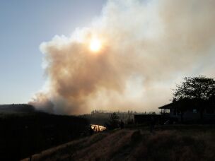 The Old Trails Fire is seen from W. Northwest Blvd., on Aug. 1, 2026, in Spokane, Wash.