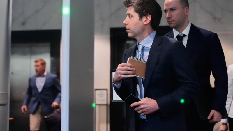 Sam Altman, center, and OpenAI president Greg Brockman, right, arrive at the U.S. District Court in Oakland, Calif., Thursday, April 30, 2026.