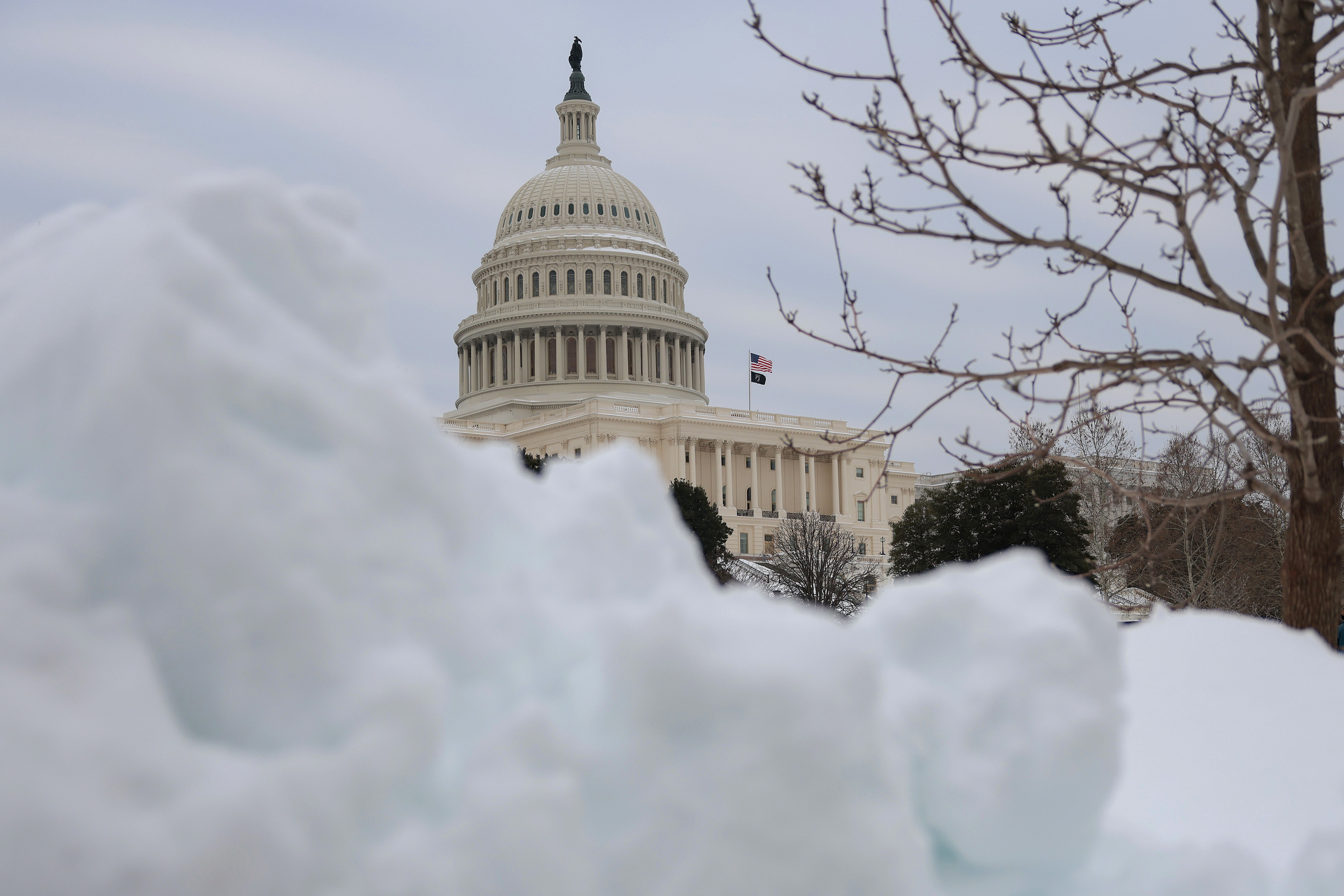 The dome of the U.S. Capitol is framed by snow on Jan 26. A fight in the Senate over DHS funding following the death of Alex Pretti in Minneapolis has the government on track for a partial shutdown at the end of this week.