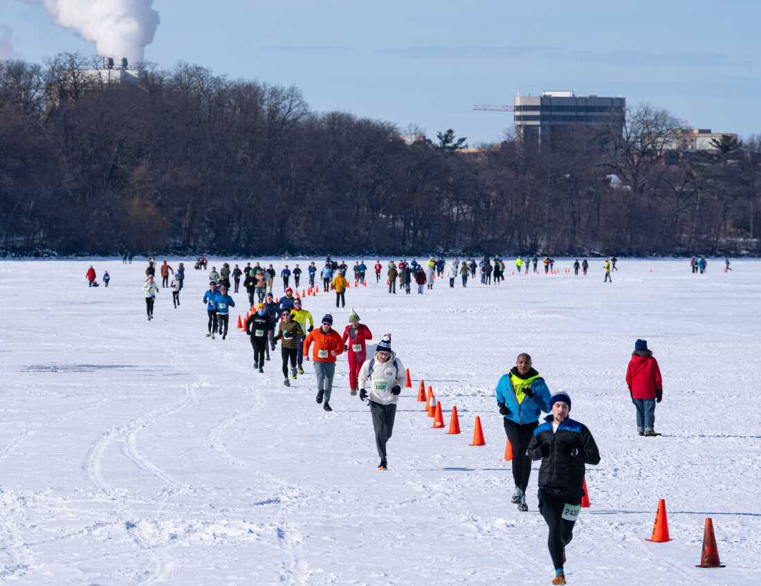 Competitors run during a 5k at the Frozen Assets Festival on Lake Mendota on Saturday, Feb. 7, 2026, in Madison, Wisconsin. Photo by Kayla Wolf