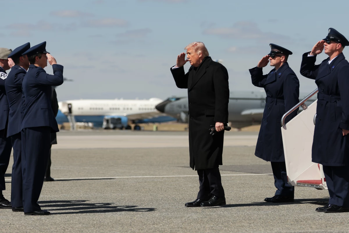 President Trump salutes at Dover Air Force Base, near Dover, Del., before attending a dignified transfer ceremony honoring six U.S. service members who were killed on March 12 in a refueling-aircraft crash in Iraq.