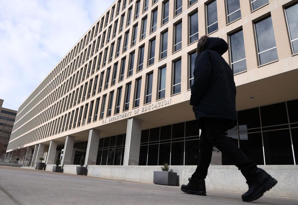 A man walks past the U.S. Department of Education building in Washington, D.C., on Feb. 7. (Zuma Press Wire via Alamy)
