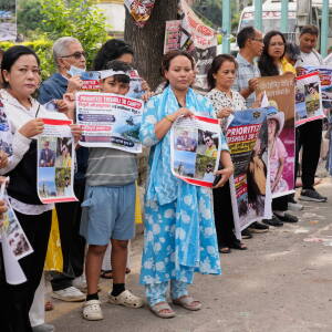 Relatives of recent flash flood victims hold banners urging authorities to step up efforts to find their missing loved ones during a demonstration in Kathmandu, Nepal, on Monday.