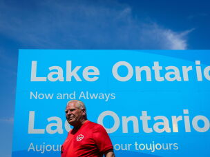 Ontario Premier Doug Ford unveils a sign for Lake Ontario at Fifty Point Conservation Area in Grimsby, Ontario, Canada, on Saturday, Aug. 29, 2026.