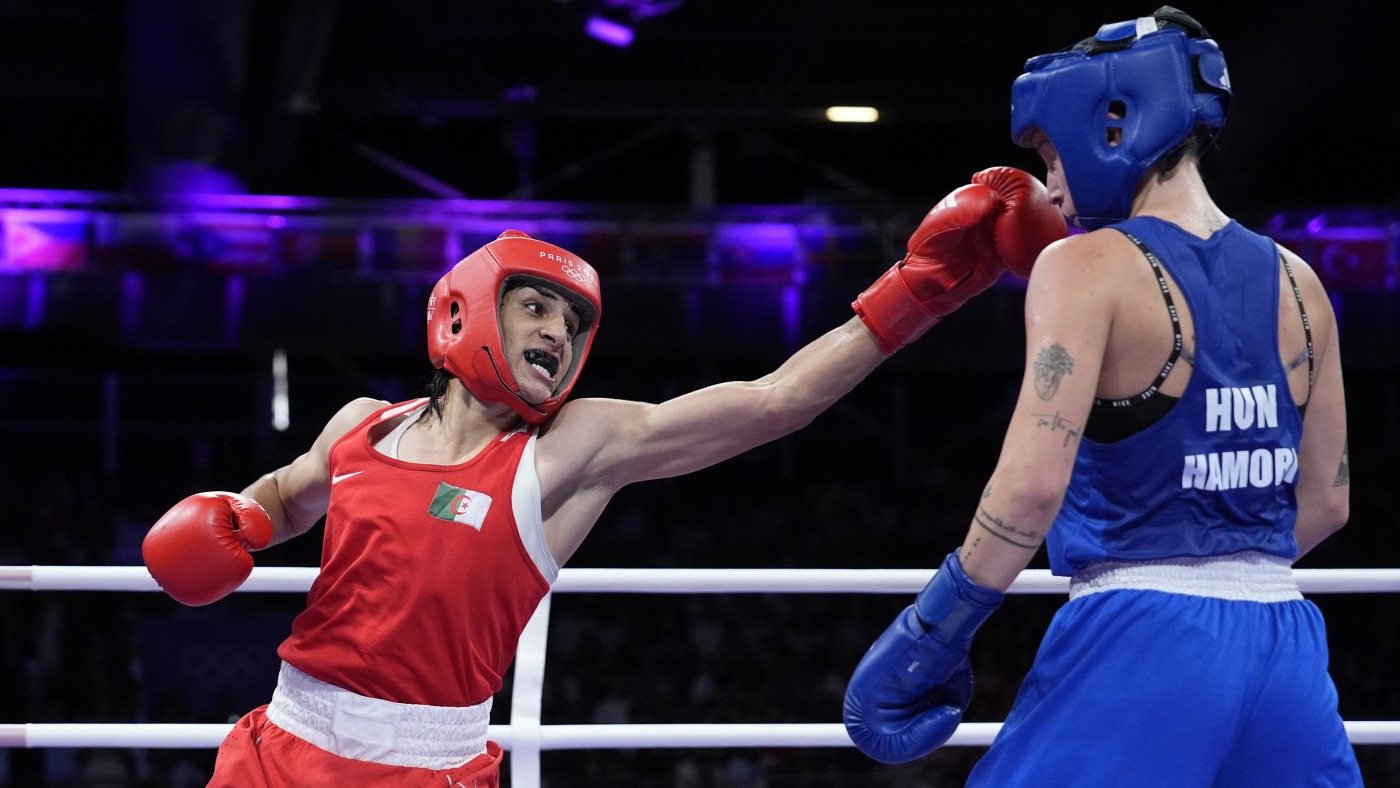 Algerian boxer Imane Khelif clinches Olympic medal after gender outcry : NPR Algerian boxer Imane Khelif clinches Olympic medal after gender outcry : NPR