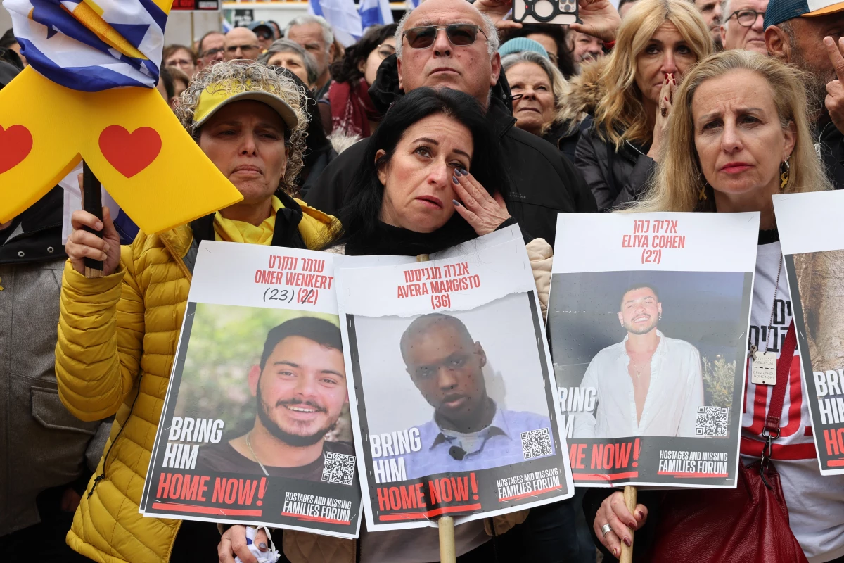 A woman reacts as people gather at 'Hostages Square' in Tel Aviv, to watch the release of Israeli hostages held by the Palestinian Hamas movement in the Gaza Strip, on Saturday.