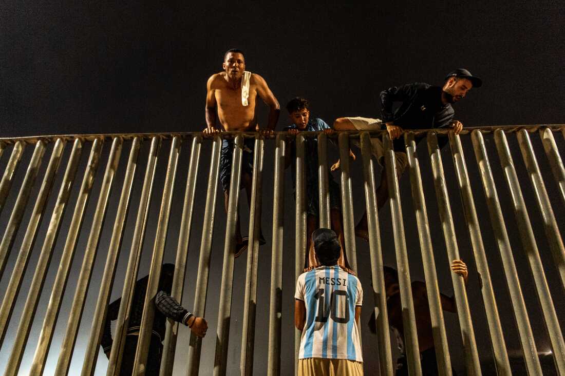 Migrants try to cross from Morocco into the Spanish enclave of Ceuta, Friday, July 31, 2026.