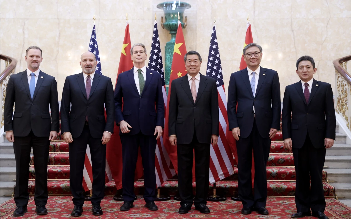 Chinese Vice Premier He Lifeng, center right, and U.S. Treasury Secretary Scott Bessent, center left, with their delegations before their meeting to discuss U.S.-China trade in London on Monday. Talks are continuing Tuesday.