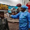 A health worker takes a woman's temperature as part of Ebola screening efforts on June 24, 2026 in Goma, Democratic Republic of Congo. 