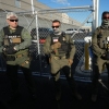 Immigration and Customs Enforcement agents stand near a gate at Delaney Hall, an immigrant detention center in Newark, N.J., in May 2025.