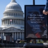 A news crew films a segment near a sign indicating that the Capitol Visitor Center is closed due to the government shutdown on Oct. 1.