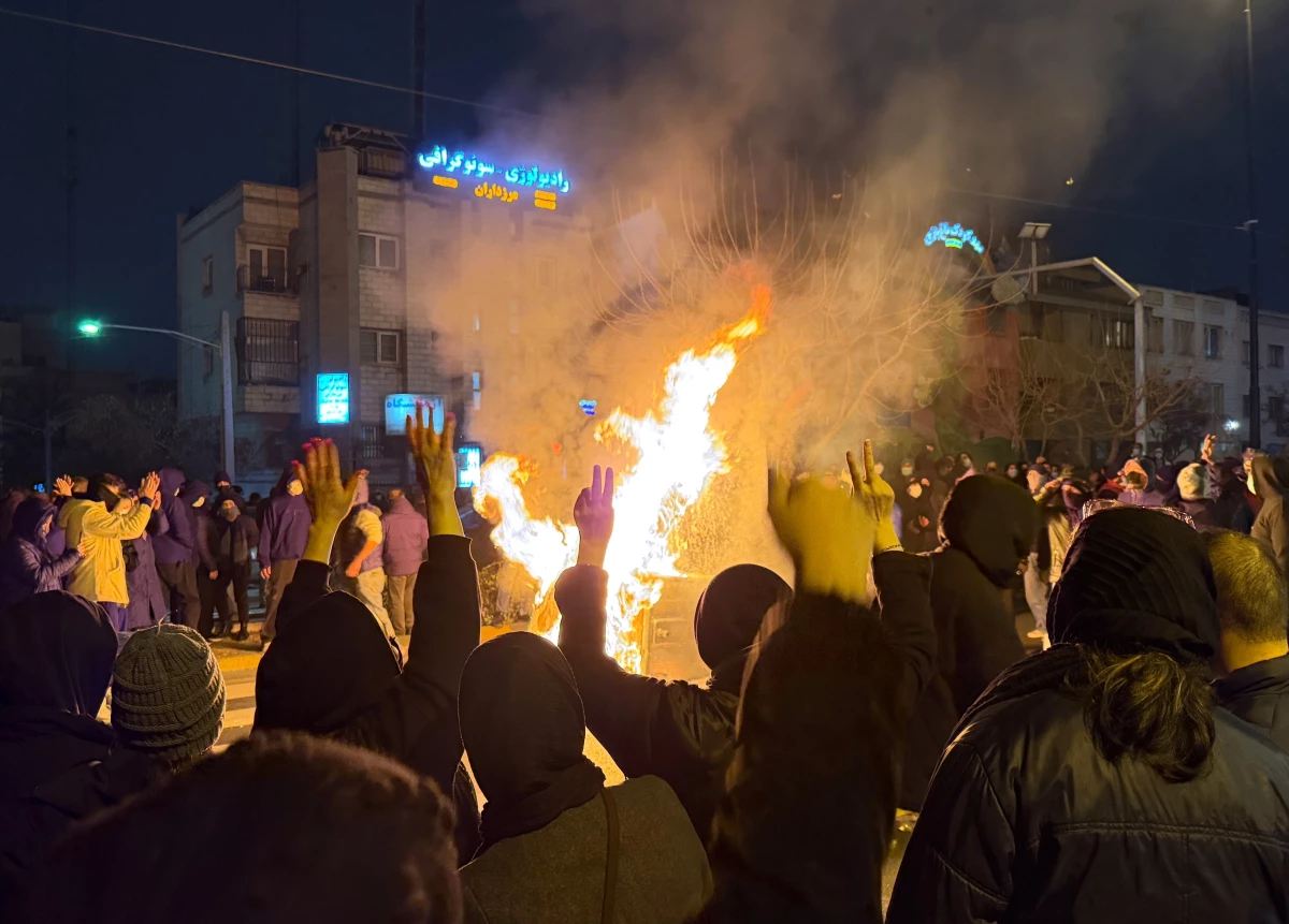 In this photo obtained by The Associated Press, Iranians attend an anti-government protest in Tehran, Iran, Friday, Jan. 9, 2026.