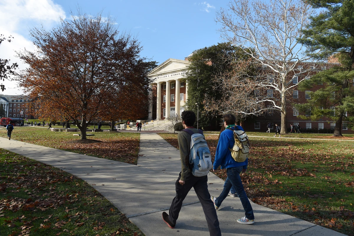 Students walk across the campus of the University of Maryland. A new round of data shows that college enrollment in the U.S. has surpassed pre-pandemic levels.