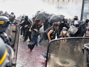 Riot police use a water cannon as they face students during a protest against under-resourced schools, in Rennes, western France, Tuesday.