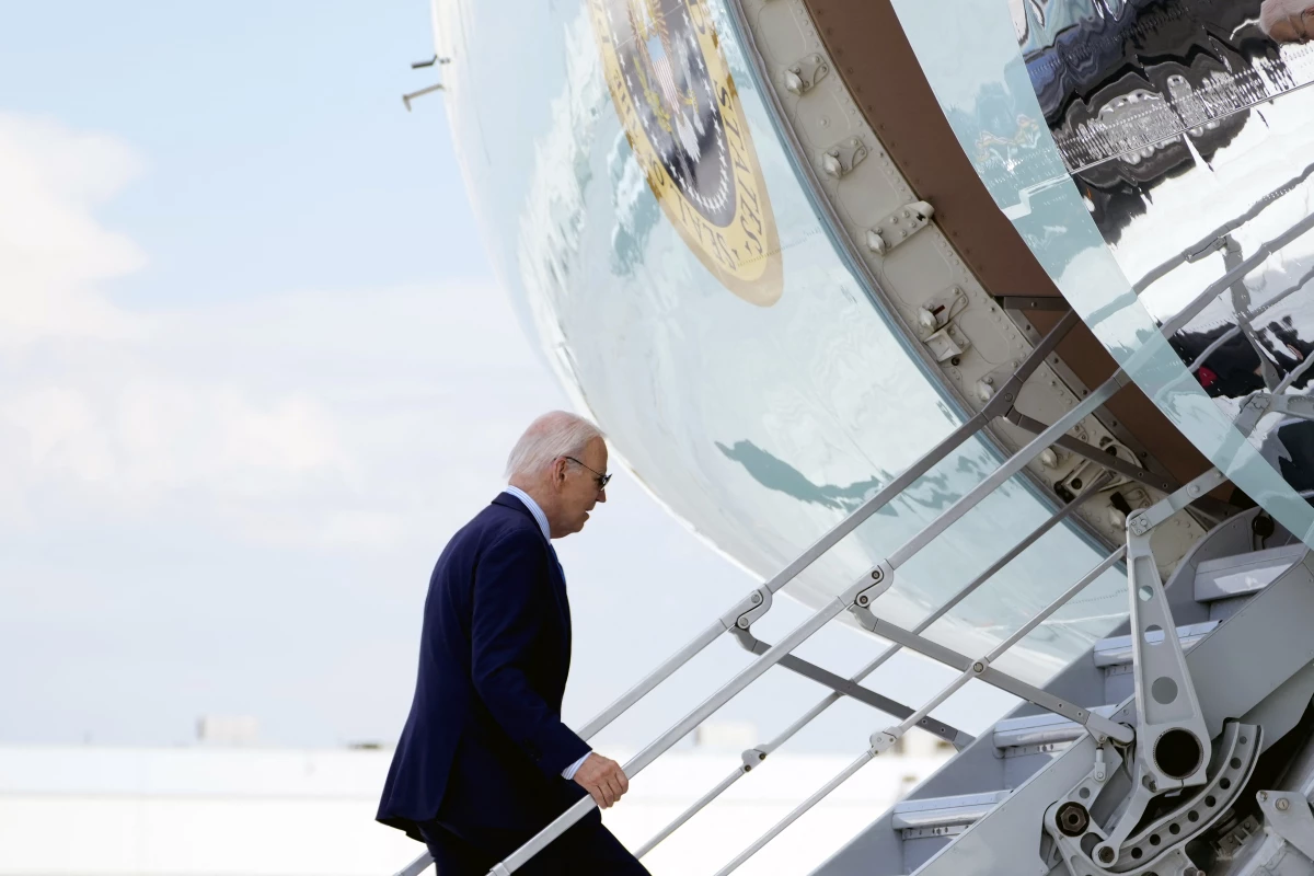 President Biden boards Air Force One as he departs Harry Reid International Airport in Las Vegas, Nevada, on July 17, 2024, en route to Delaware, after testing positive for COVID.
