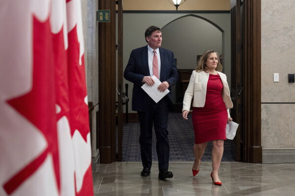 Minister of Finance and Deputy Prime Minister Chrystia Freeland, right, and Minister of Public Safety, Democratic Institutions and Intergovernmental Affairs Dominic LeBlanc arrive for a news conference on Parliament Hill in Ottawa, Ontario, on Dec. 11, 2024.