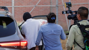 Immigration and Customs Enforcement officer Christian Castro gets into a car surrounded by news reporters moments after being released from a county detention center in Brownsville, Texas on Aug. 27, 2026.