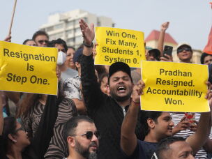 Protesters react after India's Education Minister Dharmendra Pradhan resigned following nationwide protests as part of the Cockroach Janta Party's protest movement in Mumbai, India on Saturday.