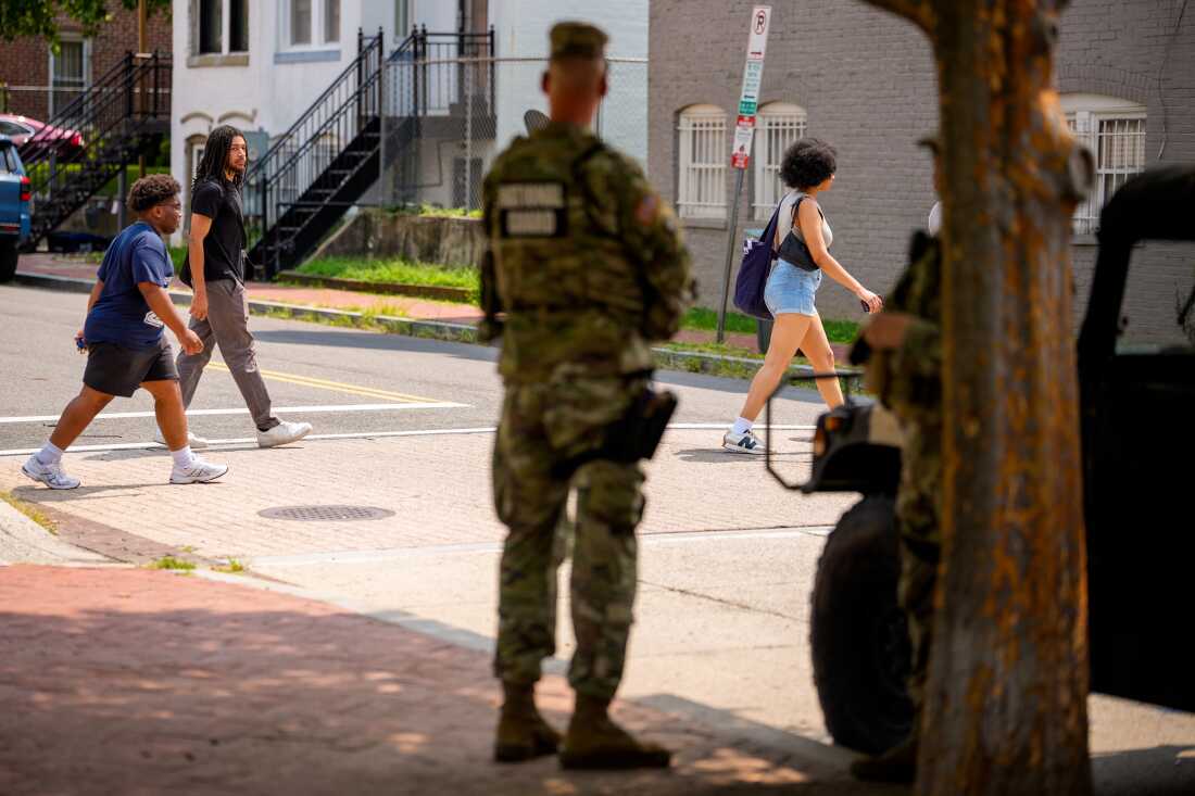 National Guard troops stand next to a military Humvee at The Park at LeDroit in Northwest on August 12, 2026 in Washington, DC. U.S. President Donald Trump is claiming credit for Washington's dramatic crime decline a year after Trump sent thousands of National Guard troops to the nation's Capitol, but the evidence shows crime was already falling before his federal intervention and the extent to which his policies accelerated that decline remains disputed. (Photo by Andrew Harnik/Getty Images)