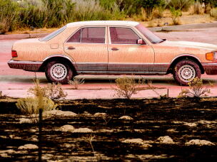 Fire retardant coats a vehicle following the Bug Fire near Reno, Nev., Thursday, Aug. 13, 2026.