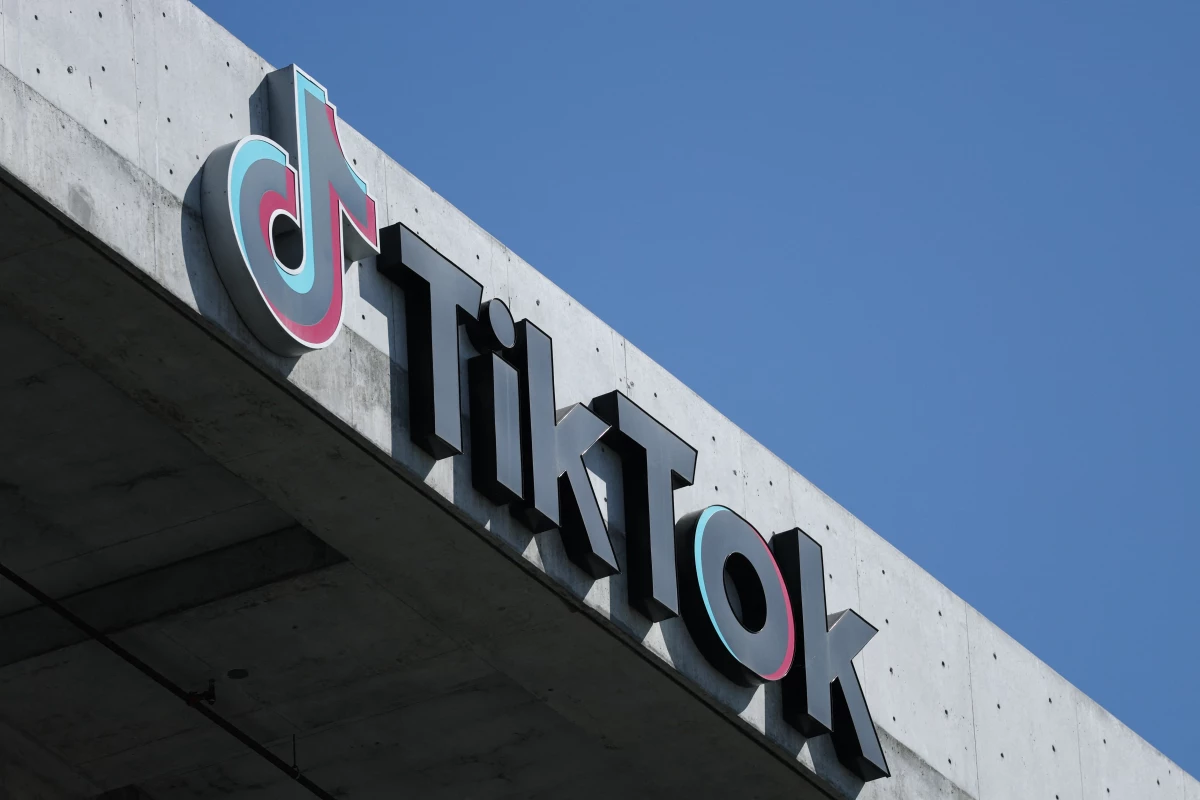 The TikTok logo is displayed on signage outside TikTok social media app company offices in Culver City, California on September 30, 2025. A new law in Virginia is designed to limit social media use by kids under 16 to one hour a day. It faces a legal challenge.