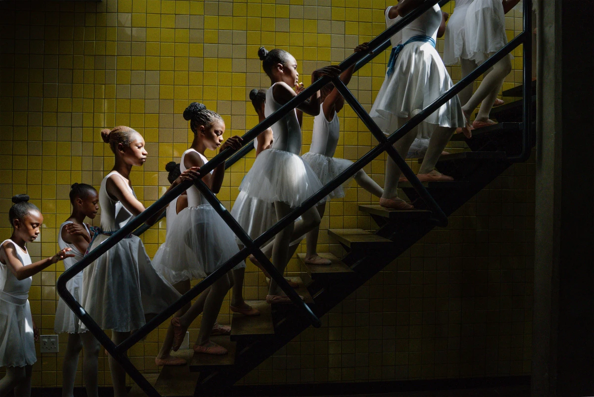 Young dancers from the Joburg Ballet School backstage at the Soweto Theatre prepare for their year-end performance. Soweto, South Africa. December 7, 2025.