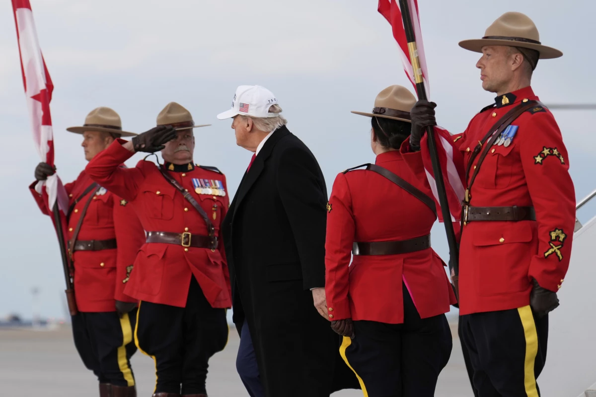 President Donald Trump arrives on Air Force One at Calgary International Airport on Sunday.