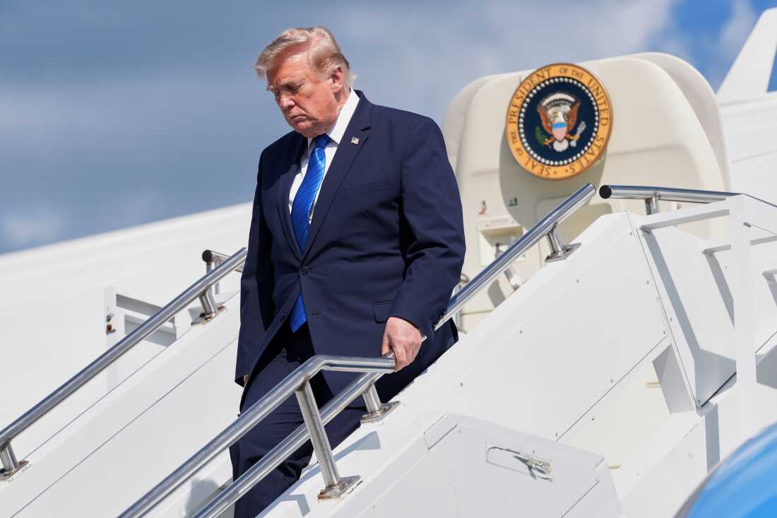 President Donald Trump exits Air Force One at Morristown Municipal Airport in Morristown, N.J., Friday, July 31, 2026, after a trip to Camp David, the presidential retreat.