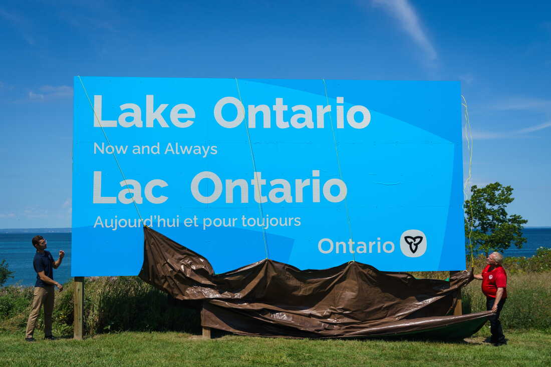 Ontario Premier Doug Ford, right, and Niagara West Member of Provincial Parliament Sam Oosterhoff unveil a sign for Lake Ontario at the Fifty Point Conservation Area in Grimsby, Ontario, Canada, on Saturday, Aug. 29, 2026.