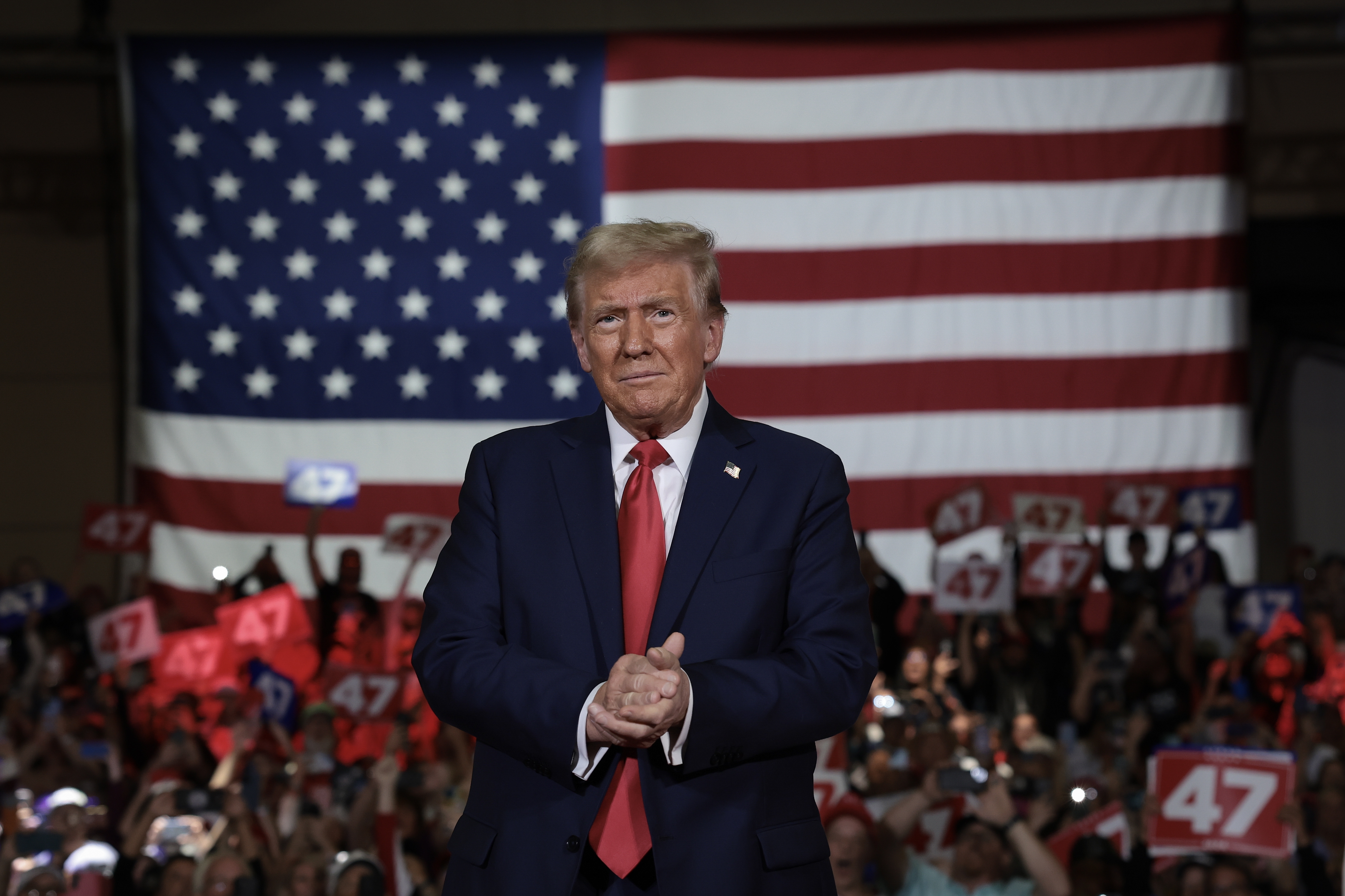 Republican presidential nominee, former President Donald Trump, arrives on stage during a town hall campaign event at the Lancaster County Convention Center on Oct. 20 in Lancaster, Pa.