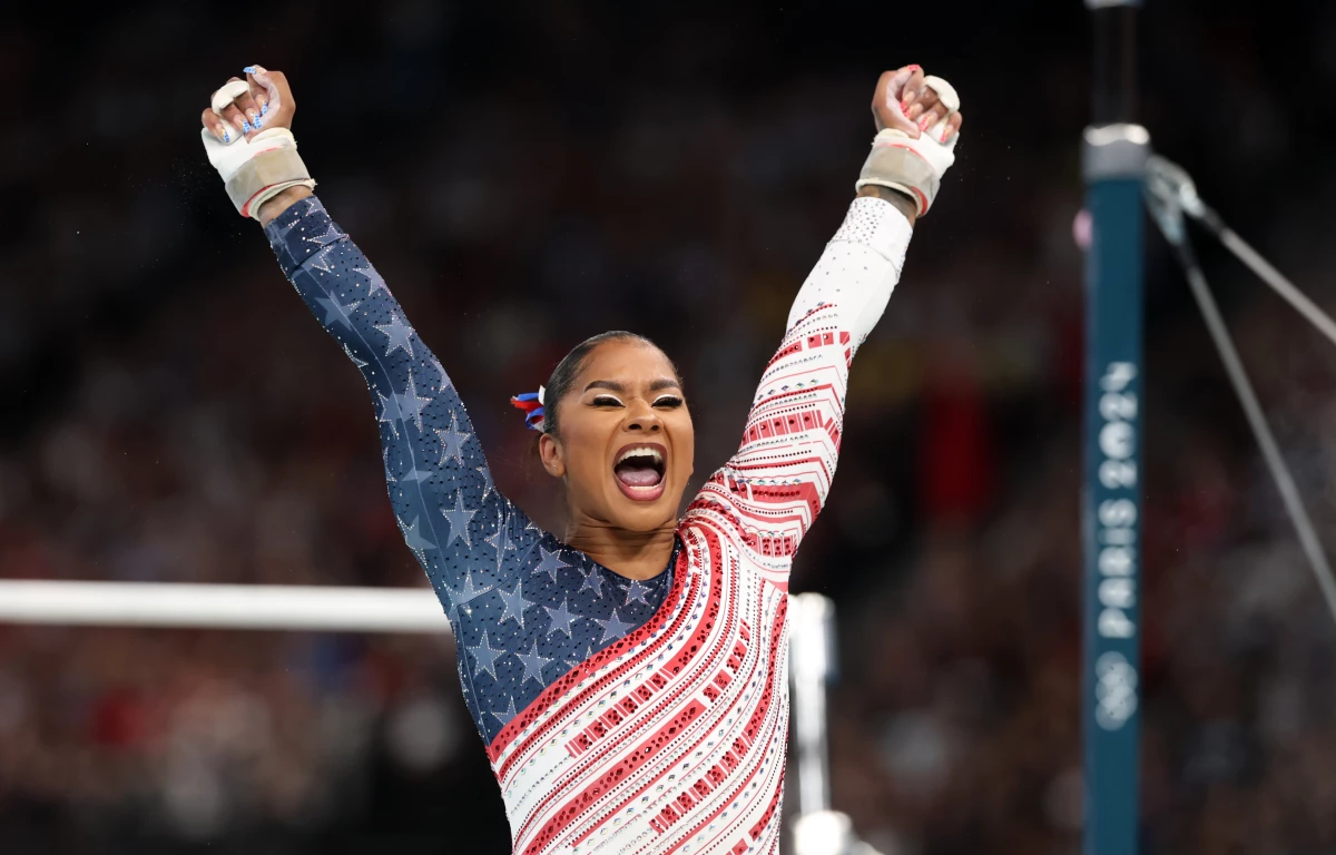Jordan Chiles of Team USA reacts after finishing her routine on the uneven bars during the Olympic Games in Paris 2024.