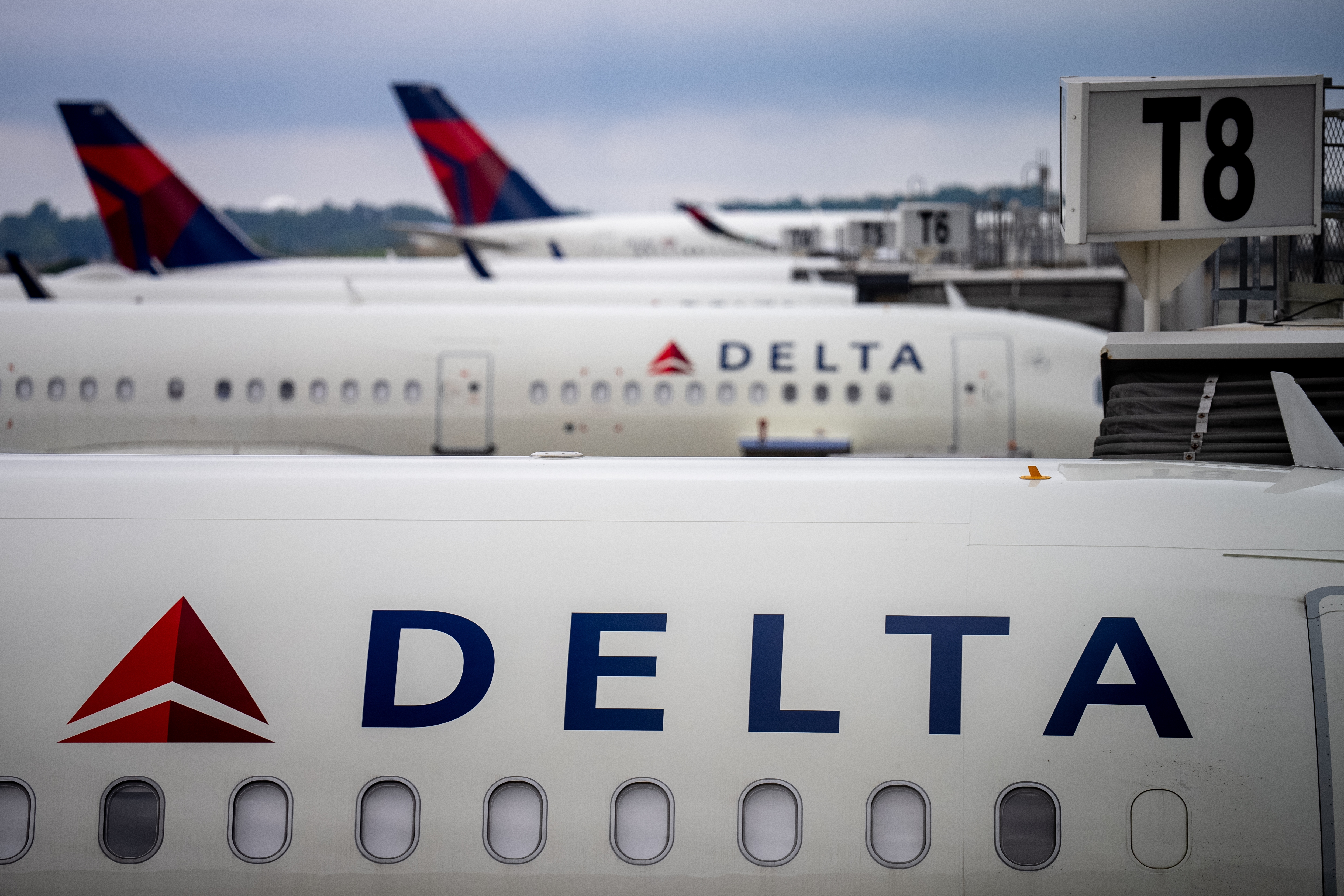 ATLANTA, GEORGIA - JUNE 28: Delta Airlines planes sit parked at Hartsfield-Jackson Atlanta International Airport on June 28, 2024 in Atlanta, Georgia.