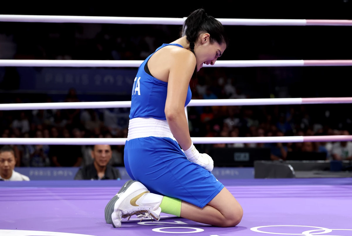 Italy's Angela Carini cries in the ring after abandoning the Women's 66kg preliminary round match against Imane Khelif on Thursday. She has since publicly apologized to Khelif.