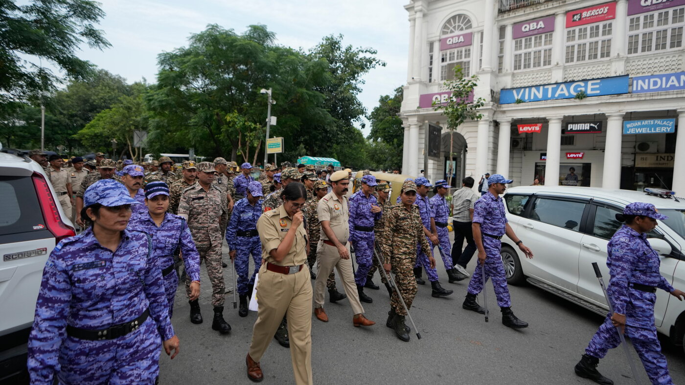 Crowds throng New Delhi and wave Indian flags amid escalating protests