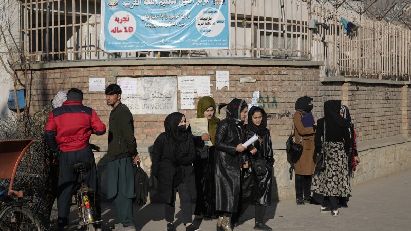 Afghan women students stand outside the Kabul University 