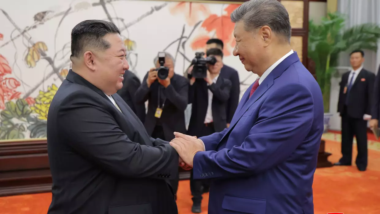 FILE - In this photo provided by the North Korean government, North Korean leader Kim Jong Un, left, shakes hands with Chinese President Xi Jinping in Beijing Thursday, Sept. 4, 2025.