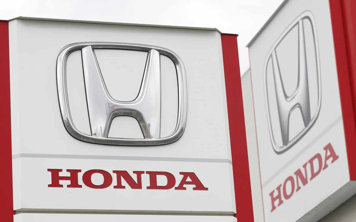 Honda Motor Co. logos are pictured in Tsukuba, northeast of Tokyo, on Feb. 13, 2019. The automaker is recalling more than 700,000 vehicles over fuel pumps that may crack and leak fuel, which could increase the risk of a fire.