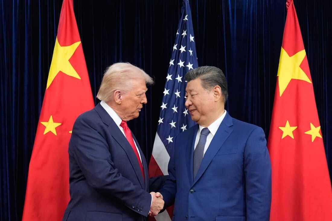 President Donald Trump and Chinese President Xi Jinping, right, shake hands before their meeting at Gimhae International Airport in Busan, South Korea.