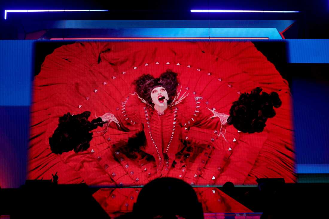 Lady Gaga's performance plays on a video onstage.
