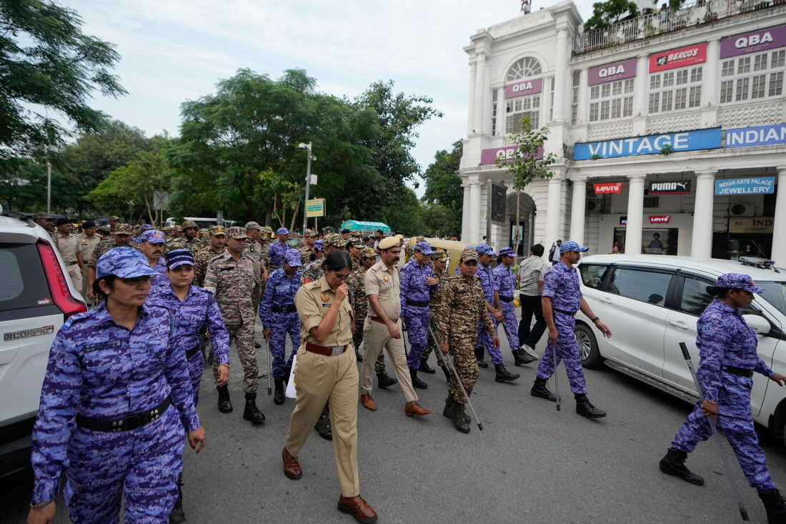 Security personnel patrol ahead of a tricolor (Indian flag) waving protest called by the youth “Cockroach” movement demanding the resignation of India’s election chief in central New Delhi, India, Friday, Oct. 16, 2026.