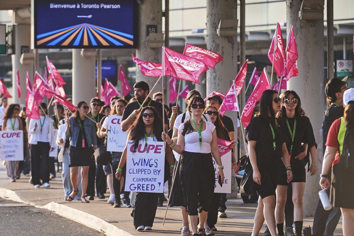 Air Canada flight attendants picket at Pearson International Airport in Toronto on Saturday.