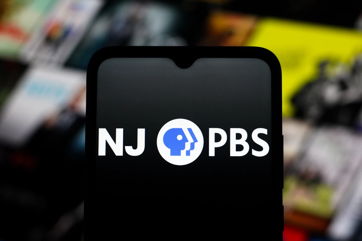 The NJ PBS logo appears on a smartphone screen. New Jersey PBS may shut down next year.