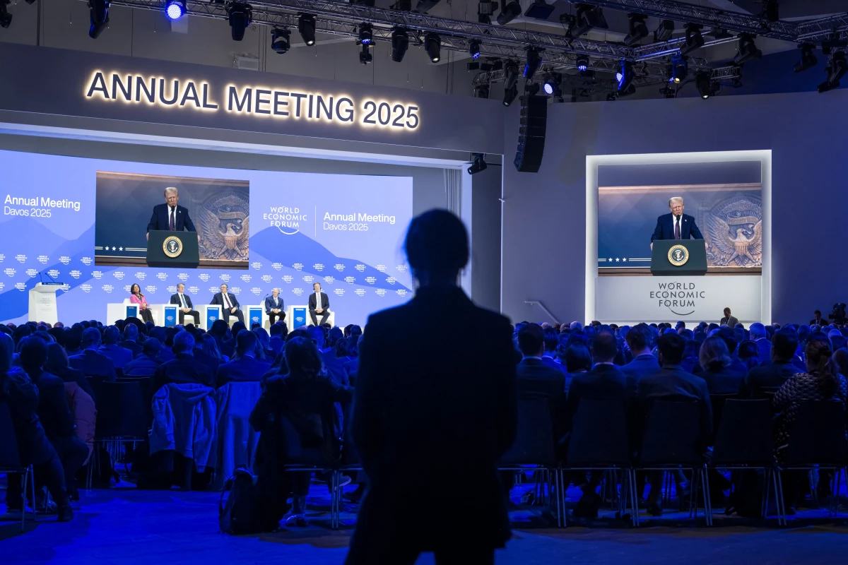 President Trump appears on a large screen during his address by video conference at the World Economic Forum's annual meeting in Davos, Switzerland, on Jan. 23.